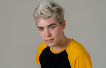 Trans boy posing in cool urban fashion t-shirt